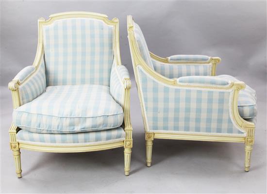 A pair of French cream painted fauteuils, W.2ft 3in. H.2ft 11in.